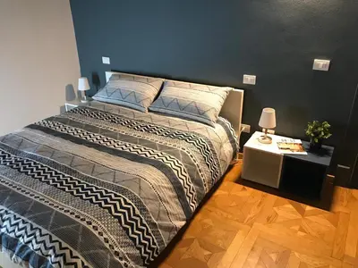 Letto o letti in una camera di Modena Charme Sant'Eufemia