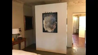 Letto o letti in una camera di Casa luminosa con giardino in centro storico