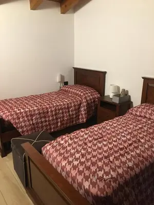 Letto o letti in una camera di B & B Lmc LA MADONNINA CHALET