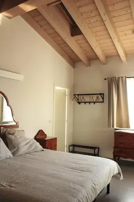 Letto o letti in una camera di Agriturismo Bacchanalis