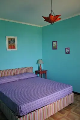 Letto o letti in una camera di B&B La vecchia quercia Home Restaurant
