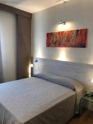 Letto o letti in una camera di NovaHotel