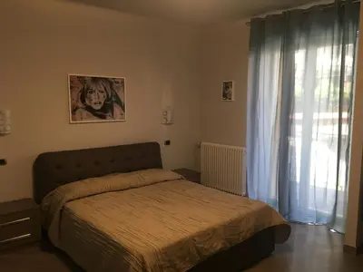 Letto o letti in una camera di Le Divine di via Olivieri - Reception Via XXV Aprile 5