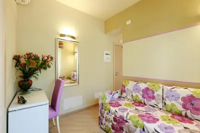Letto o letti in una camera di Hotel Souvenir
