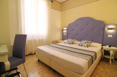 Letto o letti in una camera di Hotel Souvenir