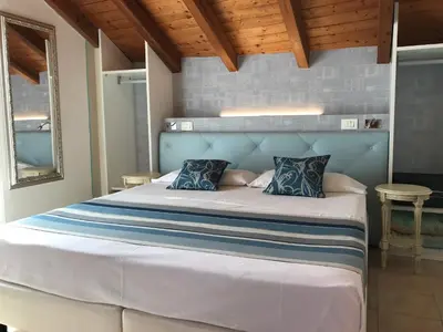 Letto o letti in una camera di Hotel Souvenir