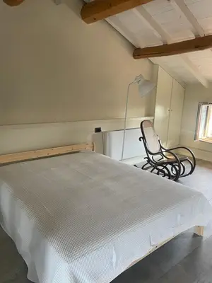 Letto o letti in una camera di AGRITURISMO LE ZORLESCHE