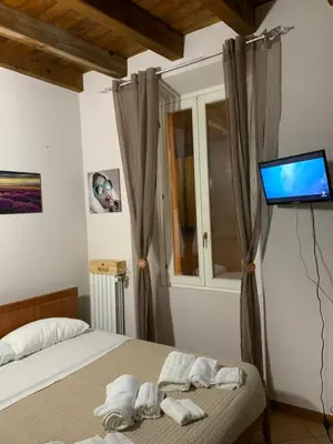 Letto o letti in una camera di La finestra sul Duomo di Pavia