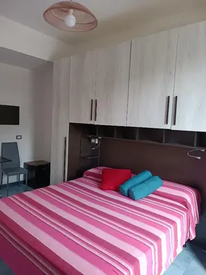 Letto o letti in una camera di Villa Caribe affittacamere