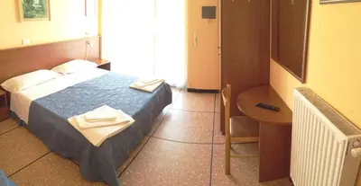 Letto o letti in una camera di Hotel Suisse