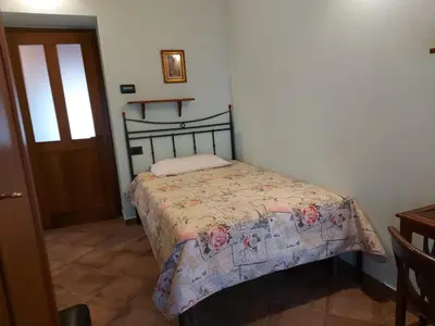 Letto o letti in una camera di LA MONTADARIA
