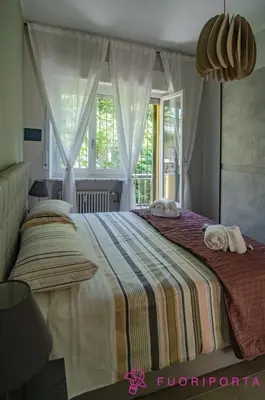 Letto o letti in una camera di FuoriPorta Affitti Brevi - Residenza Bolzoni Oliva