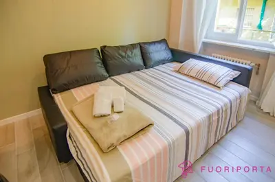 Letto o letti in una camera di FuoriPorta Affitti Brevi - Residenza Bolzoni Oliva