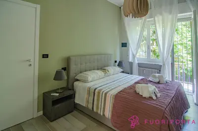 Letto o letti in una camera di FuoriPorta Affitti Brevi - Residenza Bolzoni Oliva