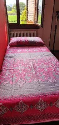 Letto o letti in una camera di Casa Cristina