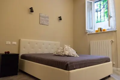 Letto o letti in una camera di Bilocale vicino Stazione CIR 00015