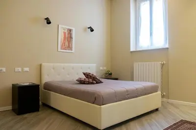 Letto o letti in una camera di Bilocale vicino Stazione CIR 00015