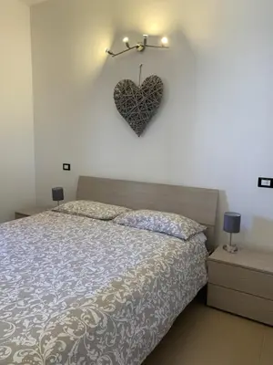 Letto o letti in una camera di La Casetta Rosa