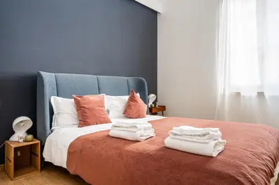 Letto o letti in una camera di GuestHost - Officina7 Large