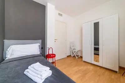 Letto o letti in una camera di GuestHost - Officina7 Large