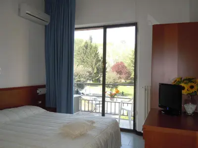 Letto o letti in una camera di Albergo Elvira