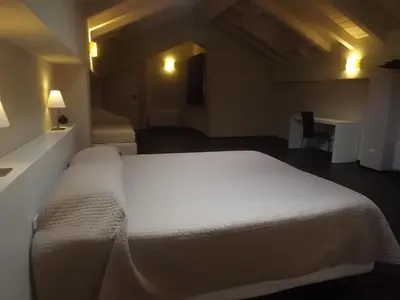 Letto o letti in una camera di Hotel Bersè