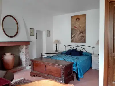 Letto o letti in una camera di B&B Castello Malaspina di Tresana
