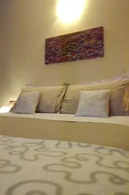 Letto o letti in una camera di B&B Il Tempo Del Vento in front of the Castle