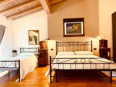 Letto o letti in una camera di La Casina