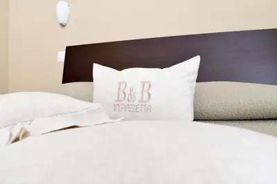Letto o letti in una camera di Affittacamere in Piazzetta