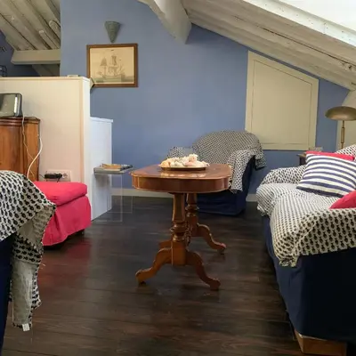 Letto o letti in una camera di La Trabacca, attico nel pieno centro di Levanto