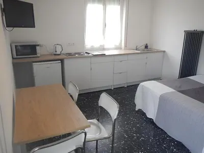Cucina o angolo cottura di La Pergola Private Parking