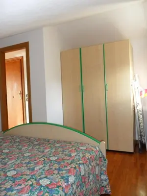 Letto o letti in una camera di MANSARDA PARADISO GOLFO DI PORTOFINO