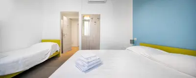 Letto o letti in una camera di b&b Amaca