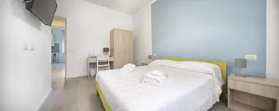 Letto o letti in una camera di b&b Amaca