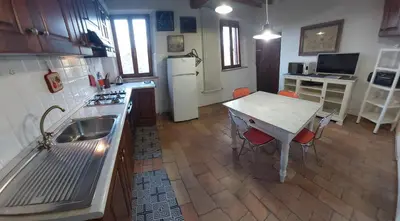 Cucina o angolo cottura di Romantic apartment garden parking in Parma city Villa Podere Merlo