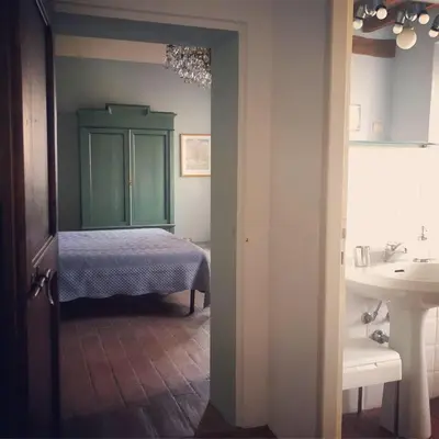 Letto o letti in una camera di Romantic apartment garden parking in Parma city Villa Podere Merlo