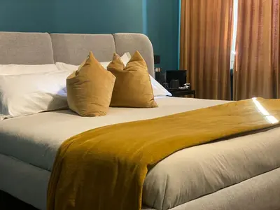 Letto o letti in una camera di Empire - Affittacamere