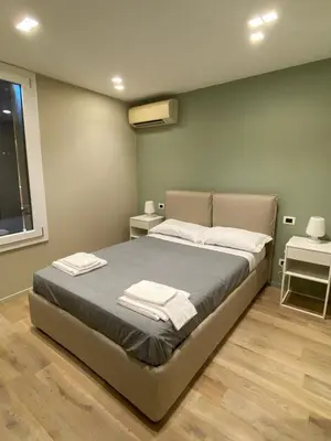 Letto o letti in una camera di Empire - Affittacamere