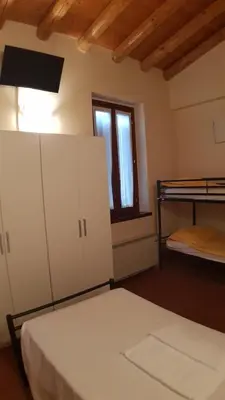 Letto o letti in una camera di Ostello Molino Di Basso