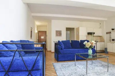 Area soggiorno di Parma Central Apartments