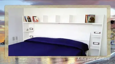 Letto o letti in una camera di A due passi dal mare