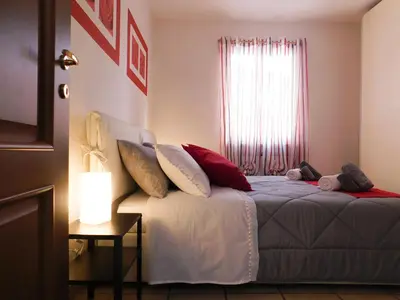 Letto o letti in una camera di La perla rossa
