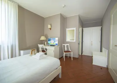 Letto o letti in una camera di HC Hotel Il Gelso Pontevico