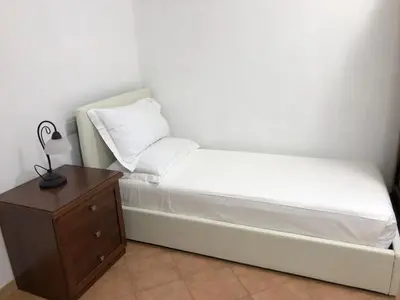 Letto o letti in una camera di B&B Giulia