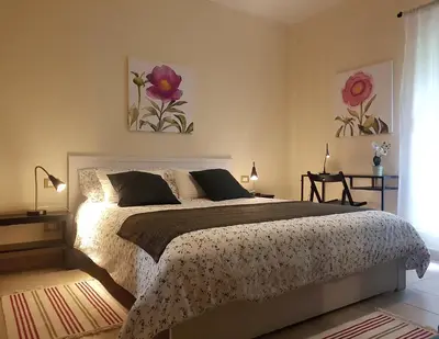 Letto o letti in una camera di Il Bosco di Campo Marzano Garden Apartments