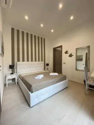 Letto o letti in una camera di Maestrale Charme Rooms