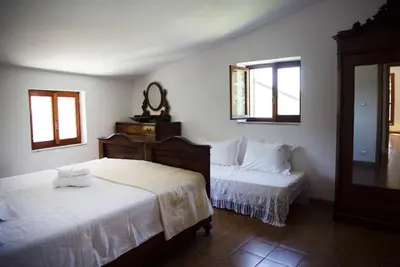 Letto o letti in una camera di Nonna Maria