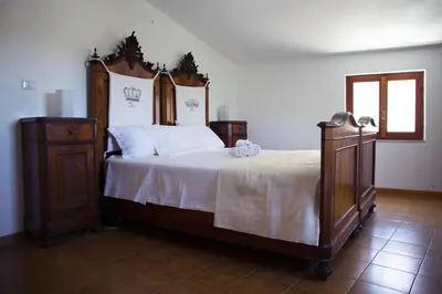 Letto o letti in una camera di Nonna Maria