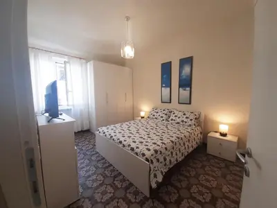 Letto o letti in una camera di House La Baia delle Favole by Holiday World